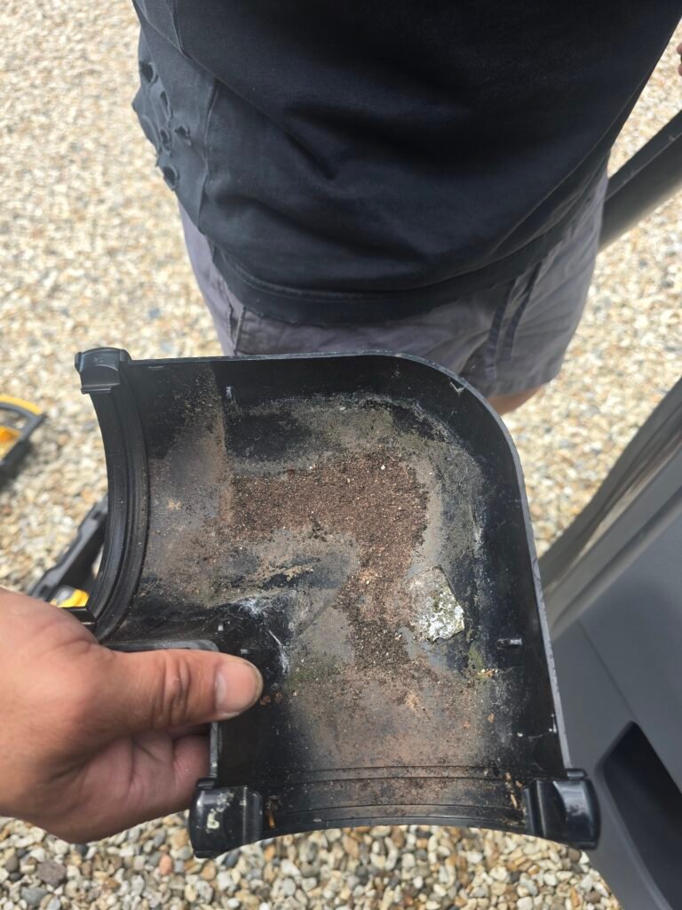 Gutter corner joint with missing rubber seal causing a water leak in Worcester